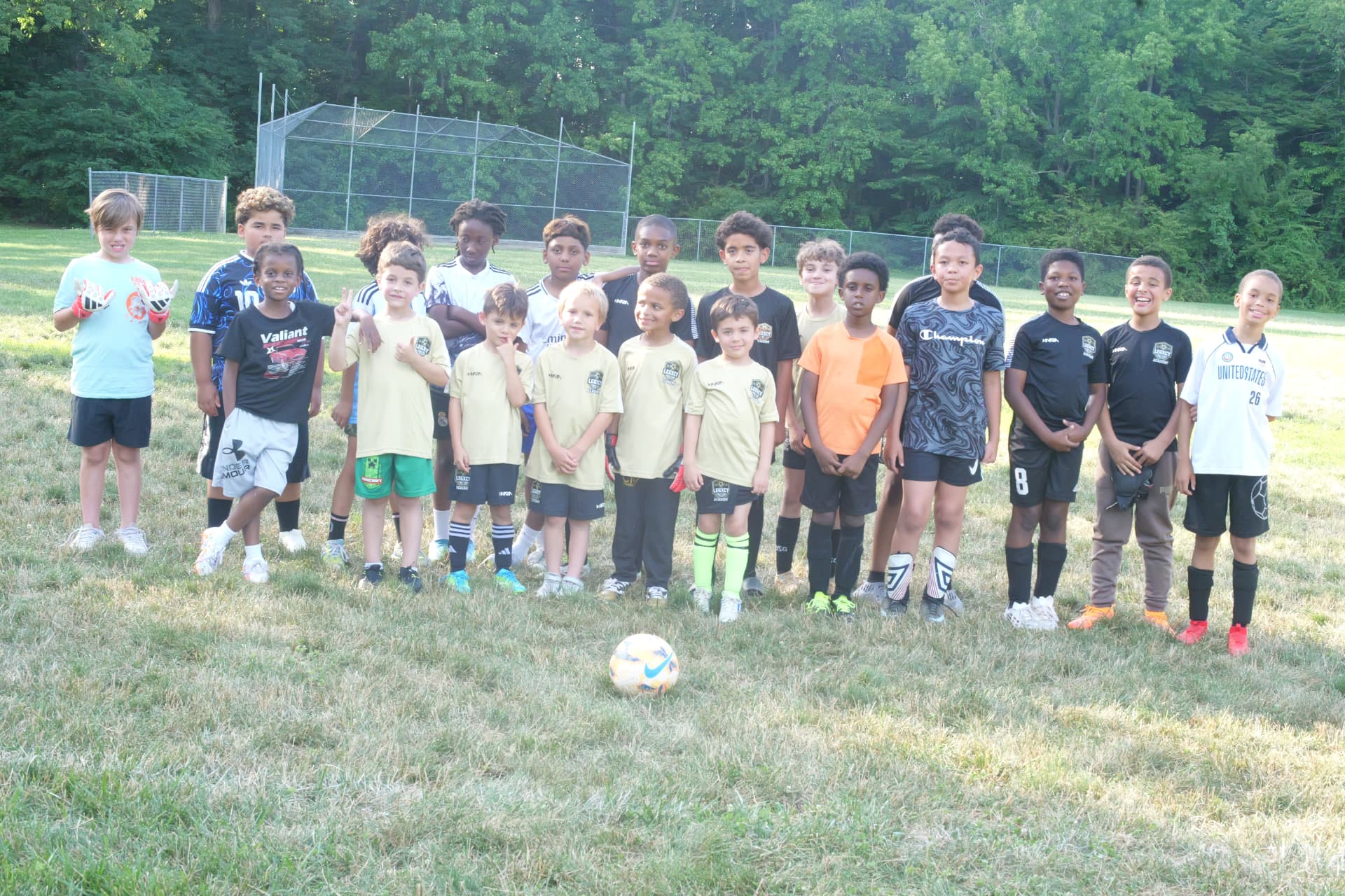 A large Legacy academy group photo on the field at Foxhill Park