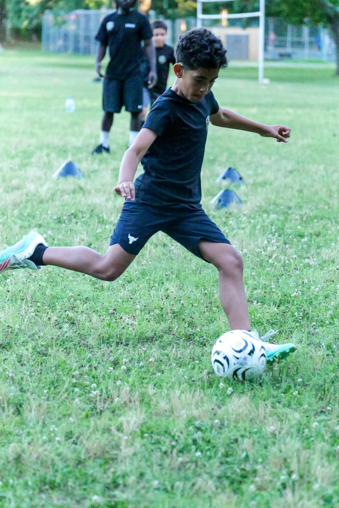 A Legacy player controlling the ball at speed in training